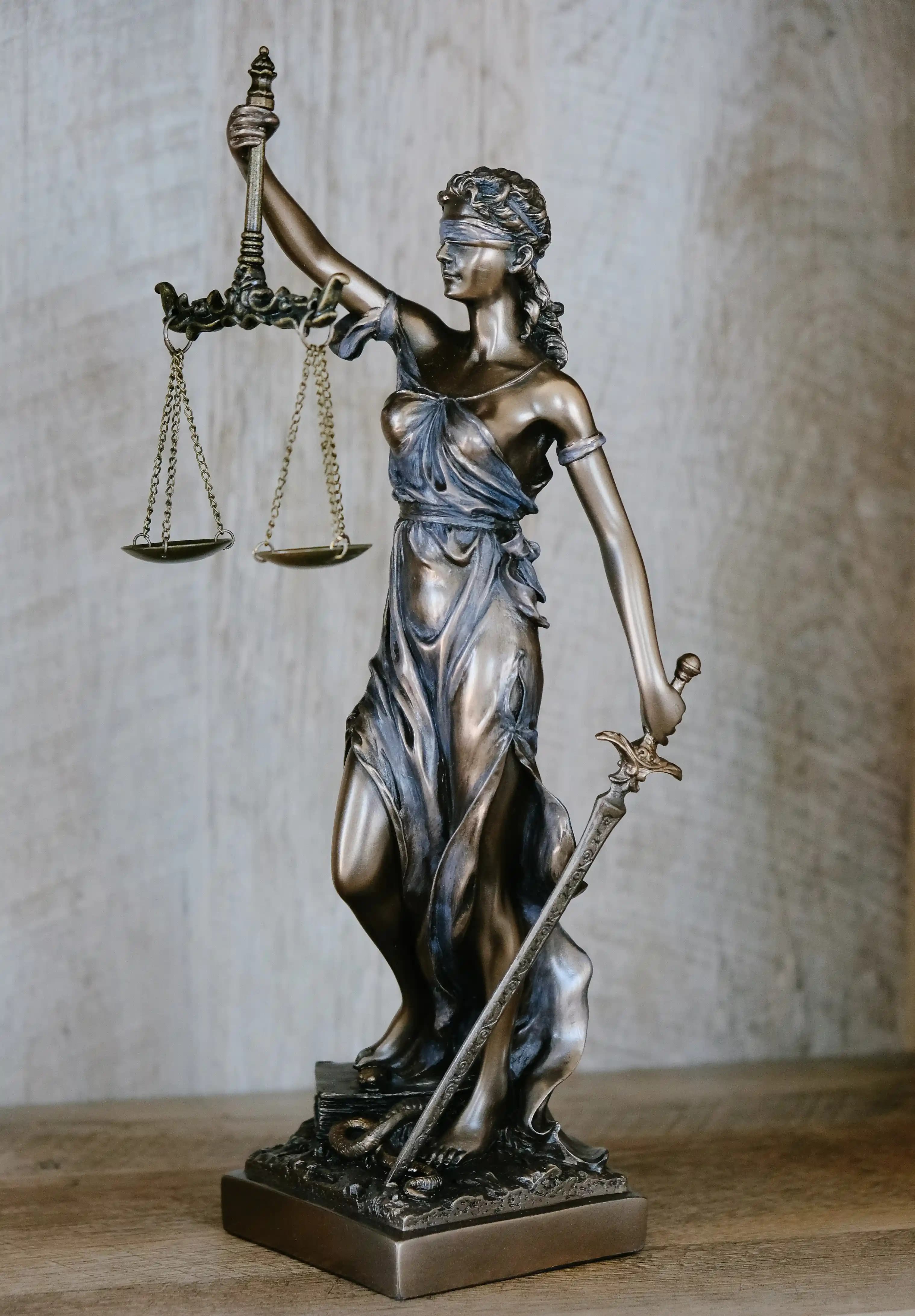 Statue of Woman Holding Scales of Justice